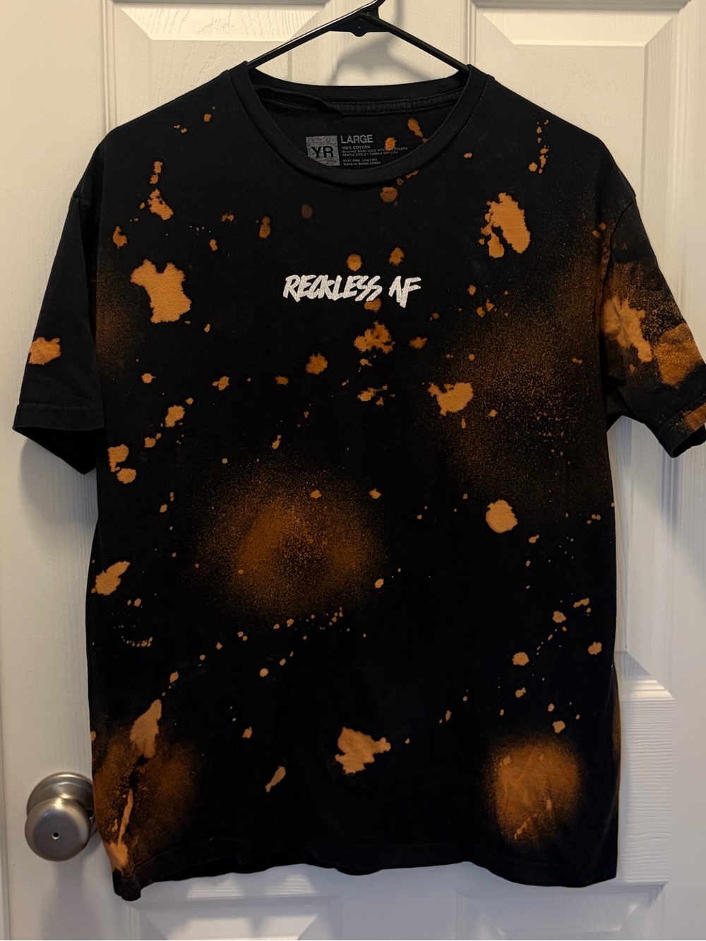 Young & Reckless Black Tee with Orange Bleach-Splatter and 'Reckless AF' Graphic